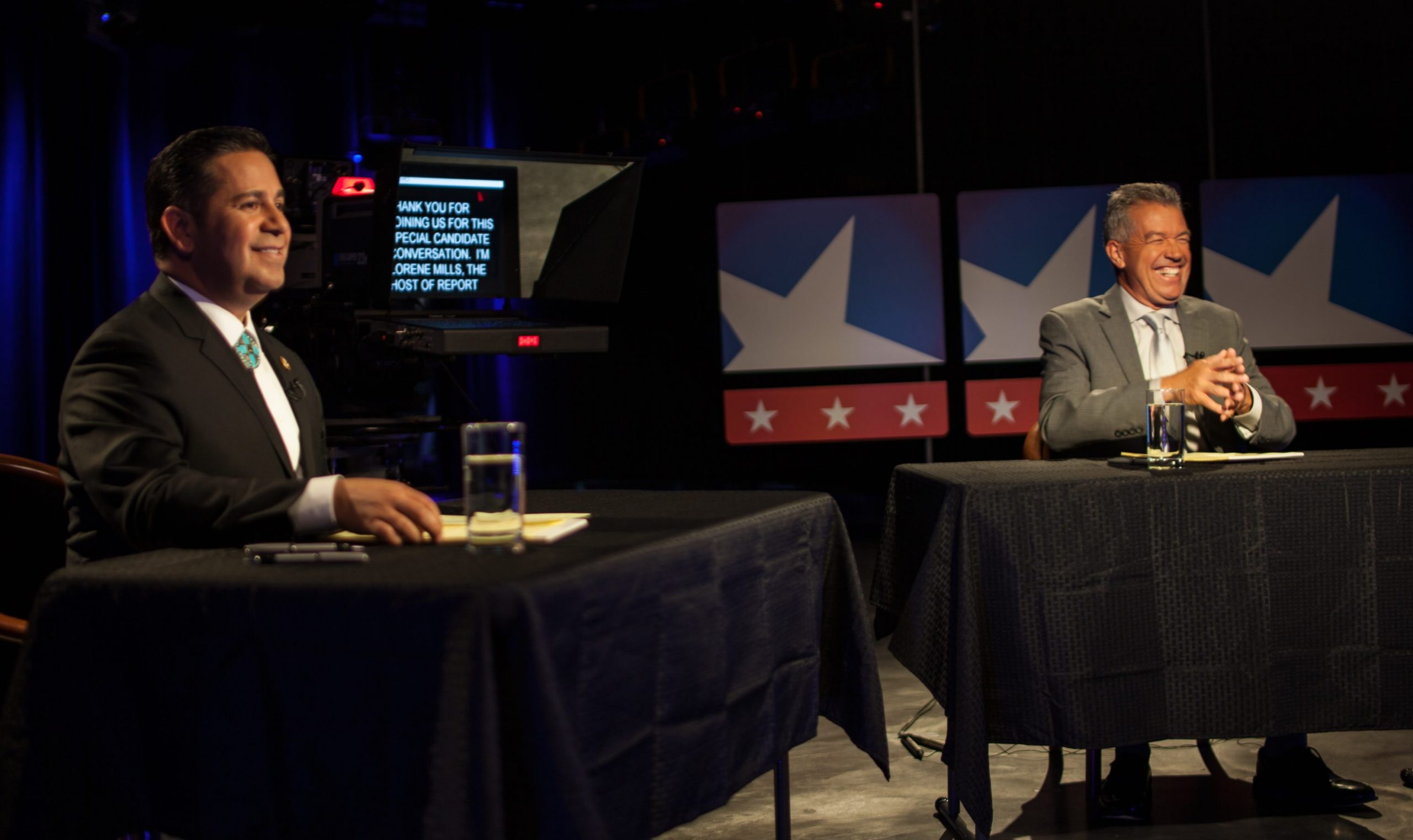 Preparing to debate on NMPBS: Ben Ray Luhan (L) and Michael Romero (R). Photo by Kevin Maestas / NM News Port