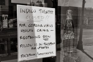 storefront window displays closure sign