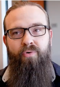 man with glasses and beard