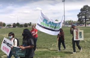 students with pro-environment signs