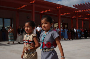 Navajo participants in dedication ceremonies at the newly opened Baca/Dlo'ay azhi Community School in Prewitt, New Mexico