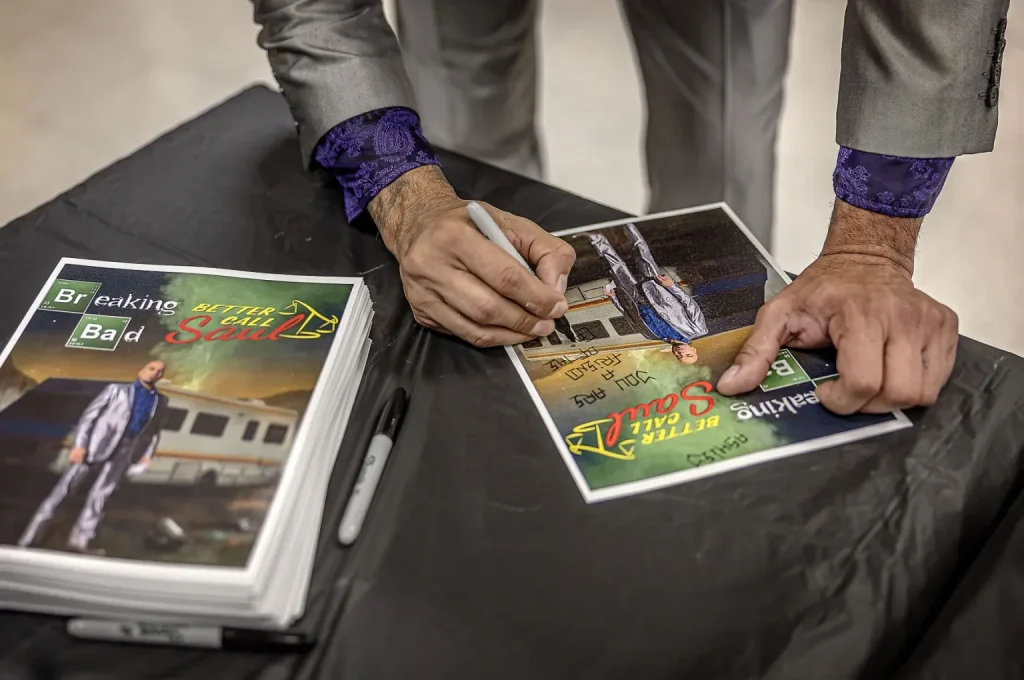 Actor Luis Moncada from the hit drama “Breaking Bad” signs autographs for staff members during a visit to the Penitentiary of New Mexico on Tuesday, Sept. 29, 2026, to meet with staff and talk with prisoners about his personal journey, mistakes and experience behind bars. Before becoming an actor, Moncada was a gang member and went to prison in the California state prison system.