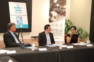 From left to right, Senator Martin Heinrich, Dahveed Torres, and Gabrielle Uballez, Executive Director of New Mexico Voices for Children, discussing ways the state can ensure their recent investments in children's well-being make a tangible difference for everyday people.