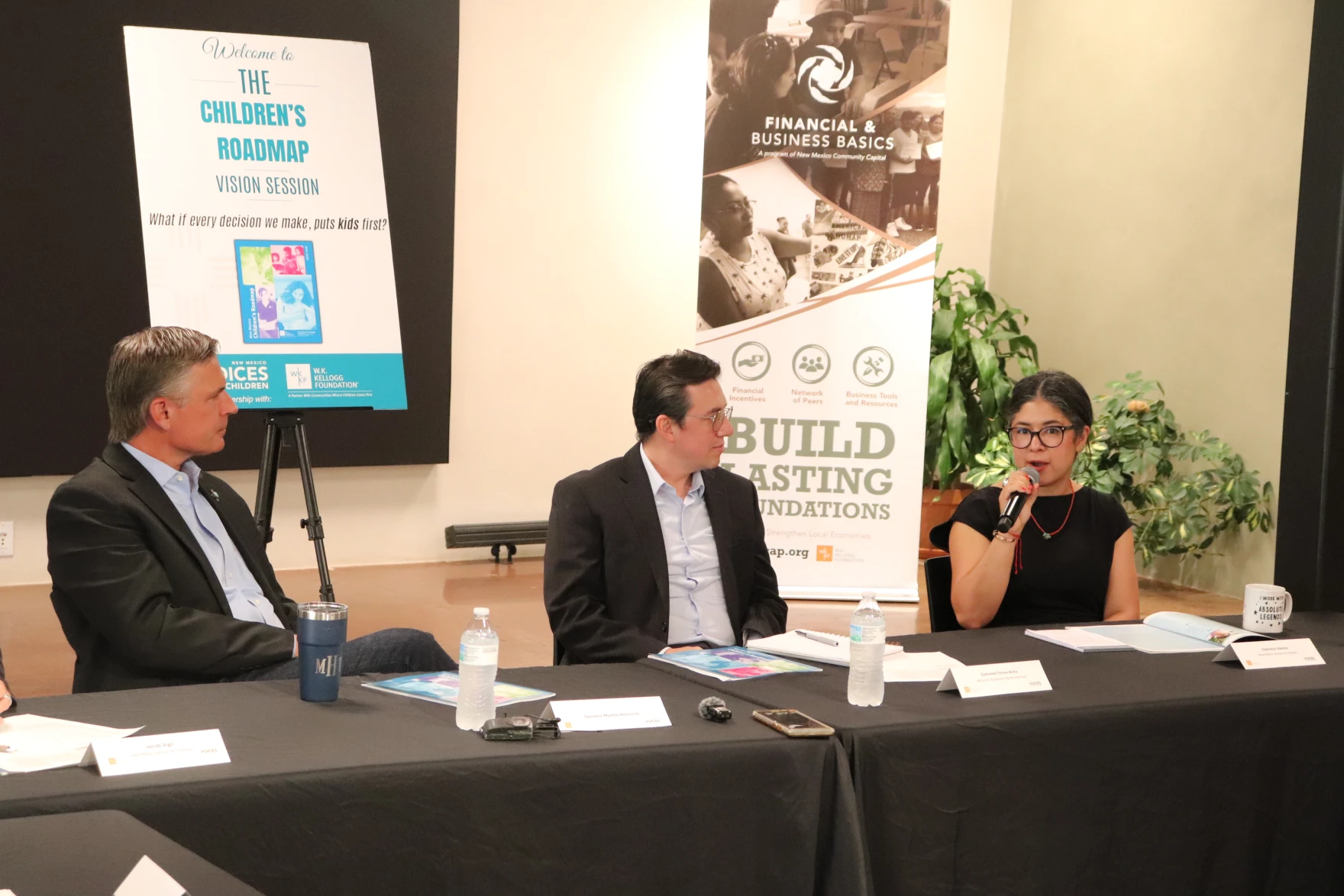 From left to right, Senator Martin Heinrich, Dahveed Torres, and Gabrielle Uballez, Executive Director of New Mexico Voices for Children, discussing ways the state can ensure their recent investments in children's well-being make a tangible difference for everyday people.