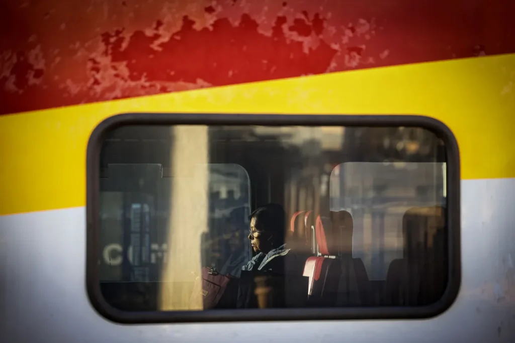 A commuter settles into her seat aboard a southbound New Mexico Rail Runner Express train at the Santa Fe Depot on Monday, Oct. 19, 2026.