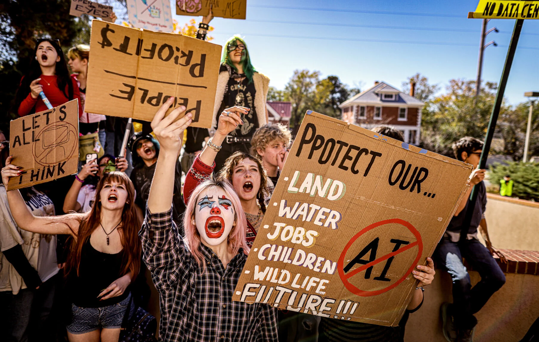 Kay Maestas, center, joins more than 100 protesters, mostly students from the New Mexico School for the Arts, in chanting outside the New Mexico State Capitol following a walkout to protest Project Jupiter, data centers and artificial intelligence on Tuesday, Oct. 27, 2026.