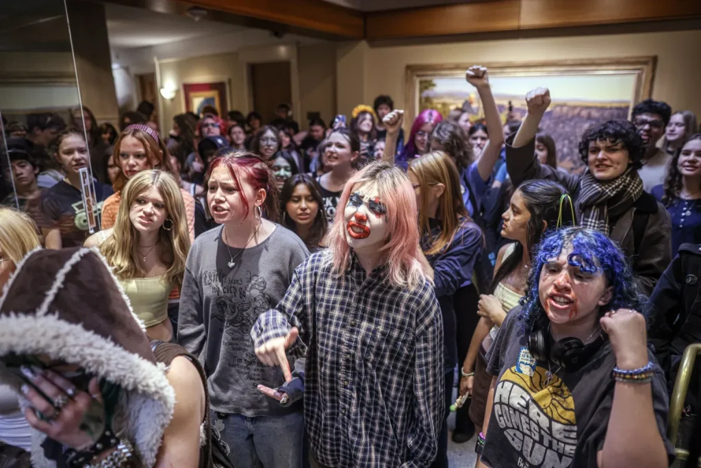 Protesters, mostly students from the New Mexico School for the Arts, chant outside the governor’s office during a protest against Project Jupiter, data centers and artificial intelligence on Tuesday, Oct. 27, 2026.