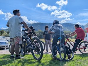 Mescalero Apache kids meet up for a bike ride in October 2026.